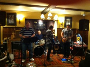 Playing guitar at the jam night